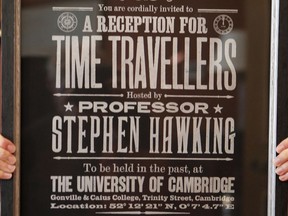 A poster advertising Time Travellers meeting hosted by Stephen Hawking, is one of the personal and academic possessions of Stephen Hawking at the auction house Christies in London, Friday, Oct. 19, 2018.  The online auction announced Monday Oct. 22, 2018, by auctioneer Christie's features 22 items from Hawking, including his doctoral thesis on the origins of the universe, with the sale scheduled for 31 October and 8 November.