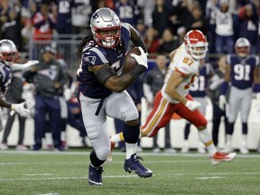 New England Patriots linebacker Dont'a Hightower runs with the ball after intercepting a pass by Kansas City Chiefs quarterback Patrick Mahomes during the first half of an NFL football game, Sunday, Oct. 14, 2018, in Foxborough, Mass.