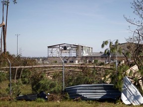 An airplane hanger at Tyndall Air Force Base is damaged from hurricane Michael in Panama City, Fla., Thursday, Oct. 11, 2018. The devastation inflicted by Hurricane Michael came into focus Thursday with rows upon rows of homes found smashed to pieces, and rescue crews began making their way into the stricken areas in hopes of accounting for hundreds of people who may have stayed behind.