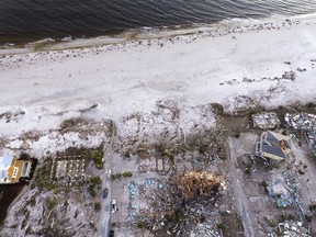 Damaged homes are seen along the water's edge in the aftermath of hurricane Michael in Mexico Beach, Fla., Friday, Oct. 12, 2018.