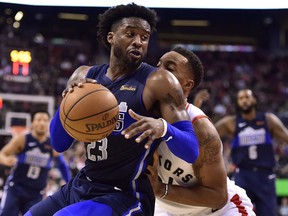 Dallas Mavericks guard Wesley Matthews (23) drives into Toronto Raptors forward Norman Powell (24)during second half NBA basketball action in Toronto on Friday, Oct. 26, 2018.