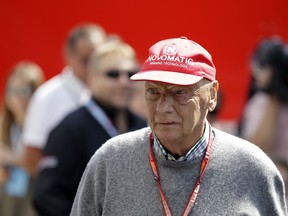 In this July 7, 2018 file photo former Formula One World Champion Niki Lauda of Austria walks in the paddock before the third free practice at the Silverstone racetrack, Silverstone, England.