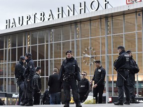 FILE - In this Feb. 4, 2016 file photo police patrols in front of the main station during the start of the street carnival in Cologne, Germany. Cologne police say they have closed parts of the western German city's main train station because of a hostage situation. The incident appears to have started Monday at a pharmacy inside the train station.