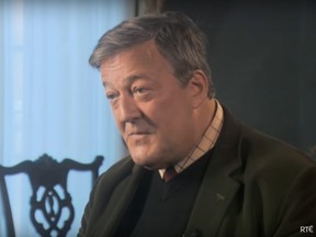 In this screenshot from a January, 2015 video by Irish state broadcaster RTE, Stephen Fry discusses God with broadcaster Gay Byrne (hidden).