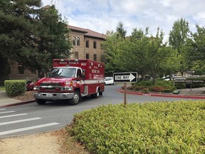 File - In this Aug. 30, 2018 file photo, an ambulance leaves Western State Hospital in Lakewood, Wash. A patient at Washington state's largest psychiatric hospital vaulted over the nurse's station, knocked a nurse to the floor, choked her and bit part of her ear off. The Sunday, Sept 30, 2018, assault is the latest in a series of attacks on health care workers at Western State Hospital.