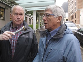 FILE - In this Aug. 21, 2017, file photo, Alaska Lt. Gov. Byron Mallott, right, speaks with reporters as Alaska Gov. Bill Walker listens in Juneau, Alaska. The governor of Alaska says Lt. Gov. Byron Mallott has resigned over unspecified "inappropriate comments." The move upends what was already a difficult re-election fight for Gov. Bill Walker. Mallott's decision was announced Tuesday, Oct. 16, 2018, shortly after Walker participated in a debate in Anchorage.