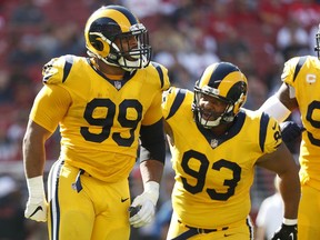 Los Angeles Rams defensive tackle Aaron Donald (99) celebrates with defensive tackle Ndamukong Suh (93) during the first half of an NFL football game against the San Francisco 49ers in Santa Clara, Calif., Sunday, Oct. 21, 2018.