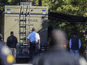 A bomb squad arrives with other authorities at a mail facility in Atlanta after reports that a suspicious package was found, Monday, Oct. 29, 2018.