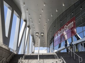 FILE - In this Oct. 18, 2018, file photo, stairs lead up to the front entrance area at the newly branded State Farm Arena, home of the Atlanta Hawks NBA basketball team in Atlanta.