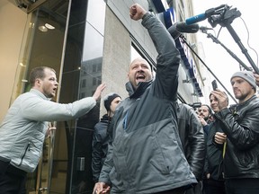 Hugo Senecal reacts as his enters a government cannabis store to buy legal cannabis products in Montreal, Wednesday, October 17, 2018.