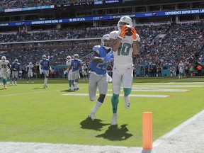 Miami Dolphins wide receiver Kenny Stills (10) catches a touchdown pass ahead of Detroit Lions cornerback Darius Slay (23), during the first half of an NFL football game, Sunday, Oct. 21, 2018, in Miami Gardens, Fla.