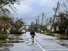 A man walks down the street after Hurricane Michael made landfall on Oct. 10, 2018 in Panama City, Florida.