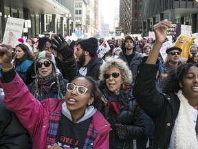 Demonstrators marched through the streets of Chicago during the Women's March Chicago on Saturday, Oct. 13, 2018.
