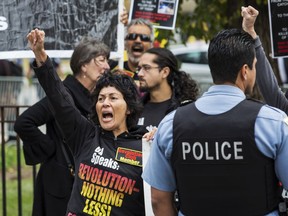 Protesters rally outside the Leighton Criminal Courthouse during closing arguments of Chicago Police Officer Jason Van Dyke murder trial in the shooting death of Laquan McDonald, Thursday morning, Oct. 4, 2018.