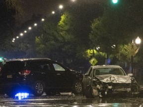 In this Monday, Oct. 1, 2018, photo, damaged cars remain on the scene of a fatal car crash in Chicago. Authorities said the driver of a speeding car who failed to stop for police caused a multi-vehicle crash.