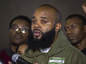 Community activist William Calloway gets emotional as he speaks to reporters at the Leighton Criminal Courthouse, Friday, Oct. 5, 2018, in Chicago, after jury found white Chicago police Officer Jason Van Dyke guilty of second-degree murder and aggravated battery in the 2014 shooting of black teenager Laquan McDonald.