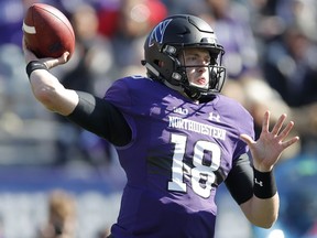 Northwestern's Clayton Thorson throws a pass against Nebraska during the first half of an NCAA college football game Saturday, Oct. 13, 2018, in Evanston, Ill.