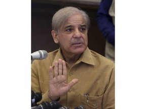 FILE - In this Saturday, July 14, 2018, file photo, Shahbaz Sharif, opposition leader and president of Pakistan Muslims League-N party gestures during press conference, in Lahore, Pakistan. Pakistan's anti-graft body says Friday, Oct. 5, 2018 it has arrested the country's opposition leader over his alleged links to a housing scam.