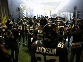 Jacksonville Jaguars players wait to run out before the first half of an NFL football game against Philadelphia Eagles at Wembley stadium in London, Sunday, Oct. 28, 2018.
