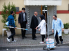 Cleaning personnel with mops, trash bags and what appeared to be bottles of bleach, wait to enter Saudi Arabia’s consulate in Istanbul, Oct. 15, 2018.