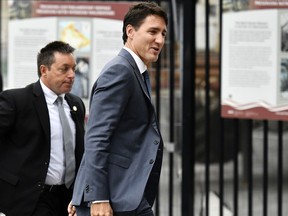 Prime Minister Justin Trudeau arrives on Parliament Hill in Ottawa, the morning after an agreement was reached on a new trade deal with Mexico and the U.S., on Monday, Oct. 1, 2018.