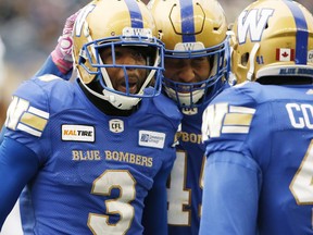 Winnipeg Blue Bombers' Kevin Fogg (3) celebrates his fumble recovery with Jovan Santos-Knox (45) during the second half of CFL action against the Saskatchewan Roughriders in Winnipeg Saturday, October 13, 2018.