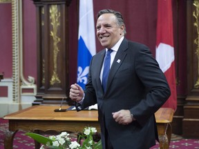 Quebec Premier designate Francois Legault walks to his wife after he was sworn in as member of the National Assembly Tuesday, October 16, 2018 at the legislature in Quebec City.