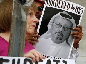 A photograph of missing journalist Jamal Khashoggi is displayed on a sign during a protest at the Saudi Arabian embassy in Washington on Oct. 10, 2018.