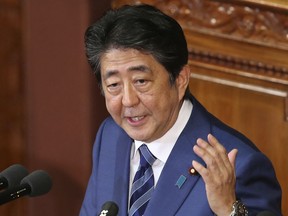 Japanese Prime Minister Shinzo Abe delivers his policy speech during a parliamentary session in Tokyo, Wednesday, Oct. 24, 2018. Abe has vowed to bolster cooperation and friendship between his country and China in a key policy speech the day before he makes the first trip to Beijing by a Japanese leader in seven years.