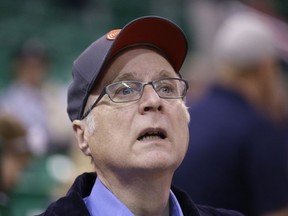 FILE - In this Oct. 12, 2015 file photo, Portland Trail Blazers owner Paul Allen looks on before the start of the first quarter of an NBA preseason basketball game against the Utah Jazz in Salt Lake City. Allen, billionaire owner of the Trail Blazers and the Seattle Seahawks and Microsoft co-founder, says cancer he was treated for in 2009 has returned. Allen made the announcement Monday, Oct. 1, 2018 on Twitter, saying he recently learned of the non-Hodgkin's lymphoma and that his team of doctors has started treatment.