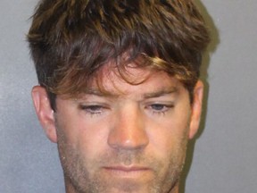 FILE - This undated booking photo provided by the Newport Beach, Calif., Police Department shows Grant Robicheaux, a California doctor who appeared in a reality TV dating show. Robicheaux, and his girlfriend are due to appear in court Wednesday, Oct. 17, 2018, on charges they drugged and sexually assaulted two women. Since those charges were filed, prosecutors said they received leads to more than a dozen other possible victims of the orthopedic surgeon and his girlfriend Cerissa Riley. (Newport Beach Police Department via AP, File)