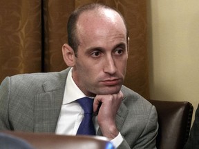 FILE - In this June 21, 2018 file photo, White House senior adviser Stephen Miller listens as President Donald Trump speaks during a cabinet meeting at the White House in Washington. A California school district has suspended a teacher who recounted how Miller ate glue as a third-grader. Nikki Fiske told the Hollywood Reporter that when Miller was a student in her Santa Monica, Calif., classroom, he was a loner with a messy desk who played with glue. The Los Angeles Times says the Santa Monica-Malibu Unified School District placed Fiske on "home assignment" while it decides what to do, if anything, about the disclosures.