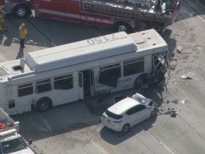 This aerial image made from video provided by KABC-TV shows the wreckage of a bus accident along Interstate 405 in Los Angeles on Sunday, Oct. 14, 2018. Authorities say at least 25 people were injured when the bus crashed into vehicles and through a concrete divider on the highway. (KABC-TV via AP)
