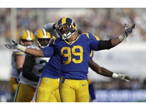 Los Angeles Rams defensive tackle Aaron Donald reacts after sacking Green Bay Packers quarterback Aaron Rodgers during the second half of an NFL football game, Sunday, Oct. 28, 2018, in Los Angeles.