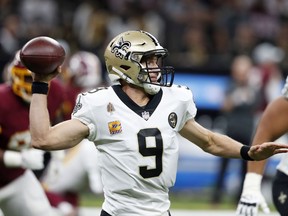 New Orleans Saints quarterback Drew Brees (9) passes in the first half of an NFL football game against the Washington Redskins in New Orleans, Monday, Oct. 8, 2018.