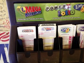 Lottery forms for Louisiana Mega Millions, Powerball and other lottery games fill the drawer at The World Bar and Grill, in Delta, La., a few miles from the Mississippi-Louisiana state line, Tuesday, Oct. 23, 2018. Mississippi residents have crossed over state lines for a chance at winning an estimated $1.6 billion jackpot in Tuesday night's Mega Millions drawing.