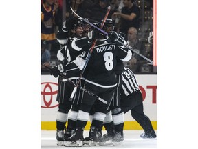 Los Angeles Kings team celebrate right wing Tyler Toffoli's goal in the first period of an NHL hockey game against the New York Islanders Thursday, Oct. 18, 2018 in Los Angeles.