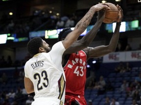 New Orleans Pelicans forward Anthony Davis (23) blocks a shot by Toronto Raptors forward Pascal Siakam (43) during the first half of a preseason NBA basketball game in New Orleans, Thursday, Oct. 11, 2018.
