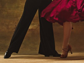 Dance ballroom couple in red dress dancing on studio background