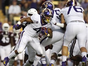 LSU running back Nick Brossette (4) runs the ball during an NCAA college football game against Mississippi State in Baton Rouge, La., Saturday, Oct. 20, 2018.