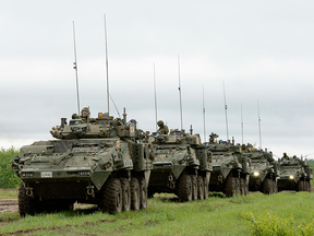 A convoy of Canadian light armoured vehicles during a training exercise.