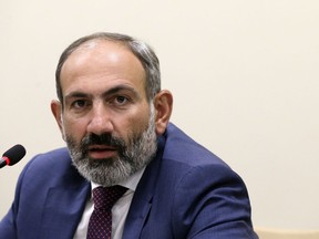 FILE - In this file photo from May 9, 2018, Armenian Prime Minister Nikol Pashinian speaks during a news conference in the capital of Nagorno-Karabakh, a region of Azerbaijan under the control of ethnic Armenian forces. Pashinian stepped down as prime minister on Oct. 16, 2018, in a political maneuver aimed at forcing an early election.