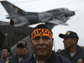 In this Monday, Oct. 15, 2018, photo, a supporter of Keiko Fujimori, daughter of Peru's former President Alberto Fujimori, wears a headband with her name as he waits for the start of a march in support of them, outside an Air Force headquarters in Lima, Peru. An appeals judge has freed Peru's opposition leader Keiko Fujimori a week after she was arrested during a money laundering investigation.