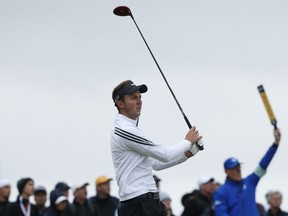 FILE - In this Thursday, July 16, 2015 file photo, England's Ashley Chesters follows his drive on the 17th tee during the first round of the British Open Golf Championship at the Old Course, St. Andrews, Scotland. Chesters was leading on 5-under 66 at the Andalucia Valderrama Masters Thursday, Oct. 18, 2018 when play was suspended because of darkness with 60 golfers yet to complete their weather-hit first rounds.