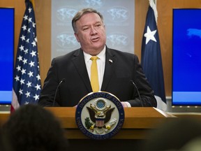 FILE - In this Wednesday, Oct. 3, 2018 file photo, Secretary of State Mike Pompeo briefs reporters at the State Department in Washington. No international letters, no international packages: A top official with a 192-country postal union says that's what Americans can expect if the Trump administration goes through with plans to pull of an international postal treaty over concerns about China. Pascal Clivaz, deputy director-general of the Switzerland-based Universal Postal Union, said on Friday, Oct. 19 the agency reached out quickly to U.S. officials after receiving a letter from U.S. Secretary of State Mike Pompeo this week announcing Washington's plan to pull out of the union in a year if the treaty isn't renegotiated.