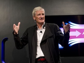 FILE - In this Wednesday, Sept., 14, 2011 file photo, Inventor James Dyson launches the Dyson DC41 Ball vacuum and the Dyson Hot heater fan on in New York. Dyson, the British company best known for innovative vacuum cleaners, has said on Tuesday, Oct. 23, 2018 it will build its electric car in Singapore. The company says the bespoke manufacturing facility is due for completion in 2020 and is part of a 2.5 billion pound ($3.2 billion) investment in new technology globally.