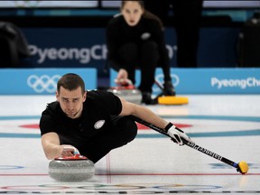 FILE - In this Feb. 7, 2018 file photo, Russian curler Alexander Krushelnitsky practices ahead of the 2018 Winter Olympics in Gangneung, South Korea. The Court of Arbitration for Sport says it has lifted a provisional ban imposed on one of the two Russian athletes who tested positive for doping at the Pyeongchang Olympics. The court says a contaminated product caused bobsled driver Nadezhda Sergeeva's positive test for trimetazidine in South Korea in February.
