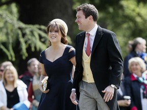 FILE - In this Saturday, May 20, 2017 file photo, Britain's Princess Eugenie and Jack Brooksbank arrive for the wedding of Pippa Middleton and James Matthews at St Mark's Church in Englefield, England. Buckingham Palace said Sunday Oct. 7, 2018 there will be military fanfare and red velvet cake when Princess Eugenie marries drinks-company executive Jack Brooksbank on Friday in Windsor Castle's St. George's Chapel.