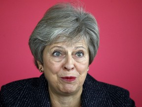 Britain's Prime Minister Theresa May attends a roundtable meeting with business leaders whose companies are inaugural signatories of the Race at Work Charter at the Southbank Centre in London, Thursday Oct. 11, 2018.