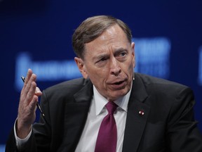 FILE - In this Monday, April 30, 2018 file photo, former CIA director retired Gen. David Petraeus speaks during a discussion at the Milken Institute Global Conference  in Beverly Hills, Calif. Writing Friday Oct. 19, 2018 in the Times of London, the former commander of American forces in Iraq and Afghanistan said the United States' military cooperation with the U.K. could be threatened by the growing use of human rights laws to target British soldiers.